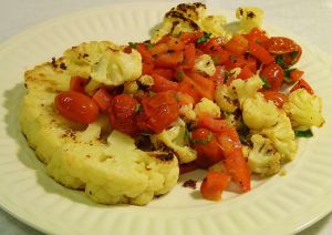 Cauliflower-Steaks-with-Roasted-Pepper-and-Tomato-Salad-on-the-plate